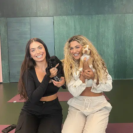 Puppy Yoga Influencers Holding Pups